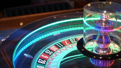 French style roulette table for money playing in Las Vegas, USA. Spinning wheel with black and red sectors for risk game of chance. Hazard amusement with random algorithm, gambling and betting symbol