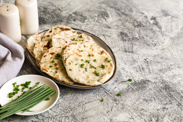 Onion naan - traditional indian bread. pita bread or scones with green onions