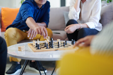 multiethnic group of business people playing chess