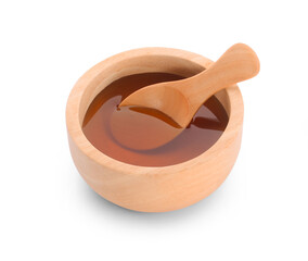 Honey with wood bowl isolated on white background.