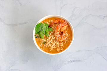 Noodle Bowls with Shrimp and Fresh Thai Basil on White Background Directly Above Horizontal Photo