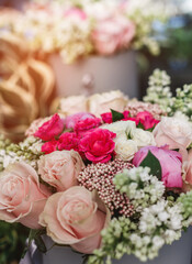 Bunch of white and pink roses flowers on holiday background. Bouquet of flowers, Wedding decoration, toning