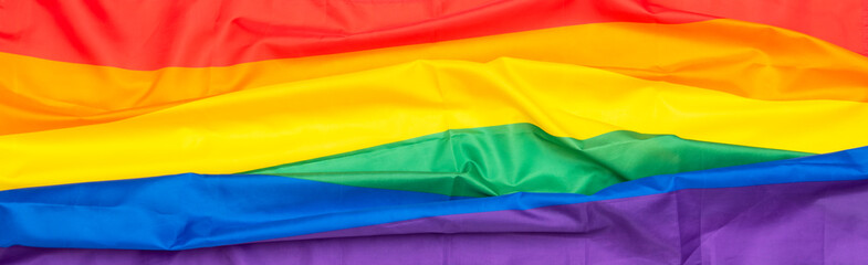 Long picture of rainbow textile flag,   LGBT flag, fabric gay, lesbian flag as background or texture