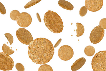 Falling oatmeal cookies isolated on a white background with clipping path. Flying food. Healthy eating. Top view