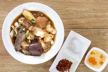 Chinese roll noodle soup with crispy pork, Thai language called *Kuay Jab* and seasoning Chinese food