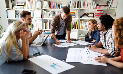 Creative brainstorming. Happy business people, designers, architects working as a team in office