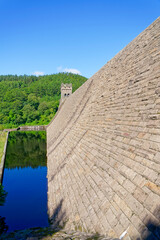 Along the stone wall of Derwent Dam to the North Tower