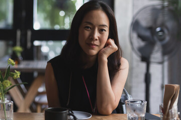 soft focus of beautiful asian woman looking at camera.