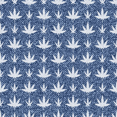 Jeans background with Cannabis Leaf. Denim seamless pattern. Blue jeans clot
