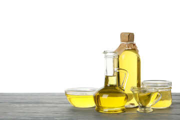 Composition with sunflower oil on wooden table isolated on white background