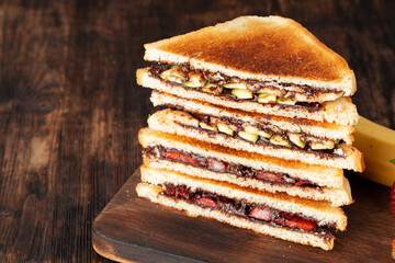 Sandwich toast with chocolate paste and cut strawberry