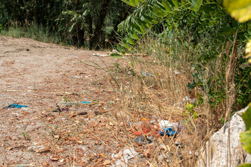 Heaps of dirty garbage rubbish in nature, pollution, plastic. Human influence on the ecology of the planet.