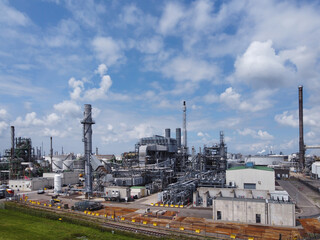 industrial area dominated by chimneys and smoke of the oil refinery, Rotterdam