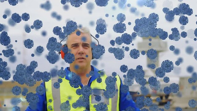 Animation of floating Covid-19 cells over Caucasian male air traffic controller at airport