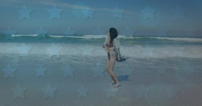 Animation of American flag waving over woman running on beach by seaside on summer holiday