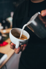 Barista hands during work - professional coffee brewing - the art of bartender