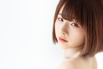 Obraz premium Headshot portrait of young asian woman sexy girl using as background cosmetics woman makeup fashion people model