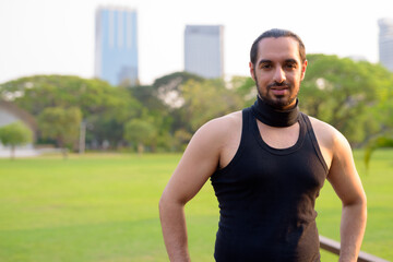 Obraz premium Young handsome bearded Indian man at the park