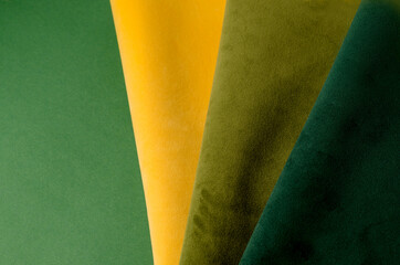 Trendy green and yellow velour textile sample. Fabric texture background