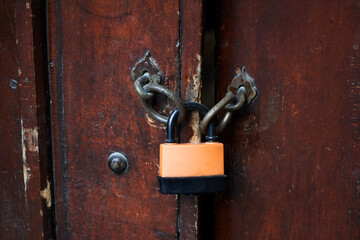 Locked wooden door. Closed for coronavirus pandemic quarantine