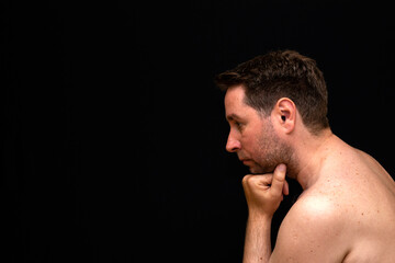 Side view sad thoughtful undressed handsome male demonstrating reverie.