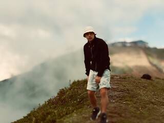 young man walking in the mountains