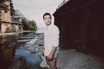 young man standing on the street