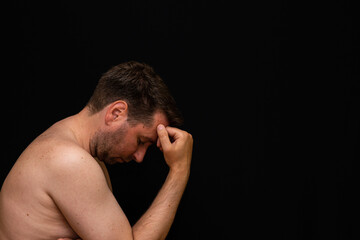 Fototapeta premium Side view sad thoughtful undressed handsome male demonstrating reverie.