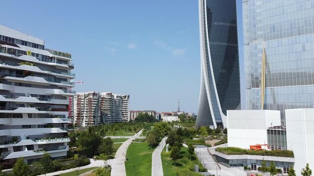 ITALY, MILAN JULY 2020, drone aerial view of (Il Dritto/The Straight One), Generali (Lo Storto/The Twisted One), PwC (Il Curvo/The Curved On) in CityLife district  shopping area after Covid19 lockdown