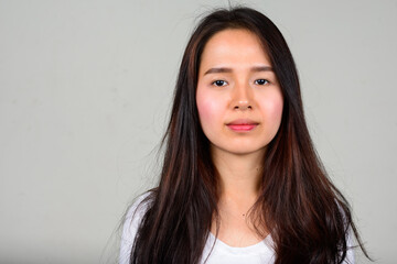 Fototapeta premium Portrait of young beautiful Asian teenage girl