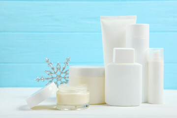 Winter care cosmetics on a colored background, place to insert text, minimalism. Skin care, skin hydration
