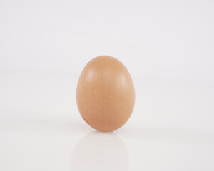 some chicken eggs laid out stand isolated on white background. These health premium eggs are commonly used for advertising or promo materials.