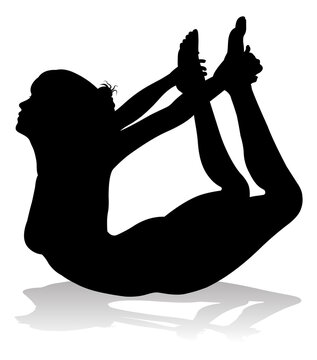A silhouette of a woman in a yoga or pilates pose
