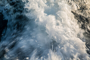 How the sun shimmers on the spray of water of the Adriatic. Big wave and splash.