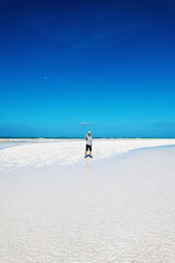 Man standing on sand bank