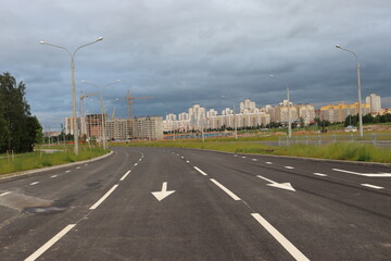 Fototapeta na wymiar newly built street road with traffic symbols