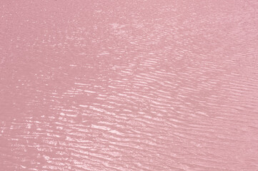 Bright, colorful background close-up, pale pink water surface lake, outdoors.