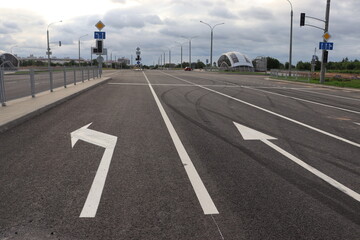 newly built street road with traffic symbols