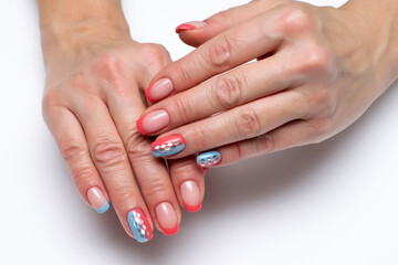 Peach, coral blue french manicure with silver rhombus on long square nails closeup	