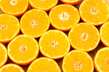 Orange slices on a wooden background. The atmosphere of summer and relaxation. Bright and juicy...