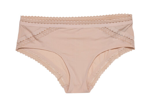 Women lingerie isolated. Close-up of a beige or flesh-colored panties isolated on a white background. Useful for wearing under bright or transparent dresses. Underwear fashion.
