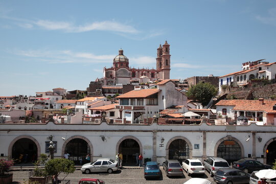 View of Santa Prisca Church and  white houses with tile roofs  in Taxco, Guerrero, Mexico
