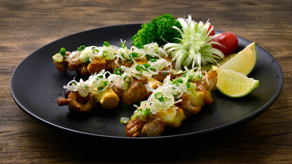 Yakitori Grilled Chicken Skewers ontop Leek Bunching Onion cutlet Japanese Food fusion style