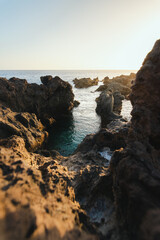 Fototapeta na wymiar illuminated rocks in the sea