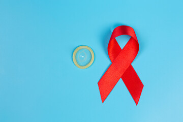 Red knowledge ribbon and condoms HIV awareness awareness, World AIDS Day and World Sexual Health...
