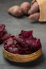 Purple glossy crispy sheets and purple glossy effect on a black background