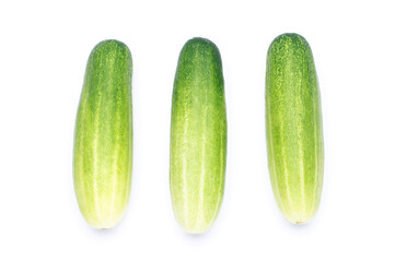 There are three organic cucumbers arranged on a white background.