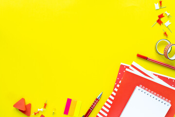 School colorful stationery on yellow background with copyspace.