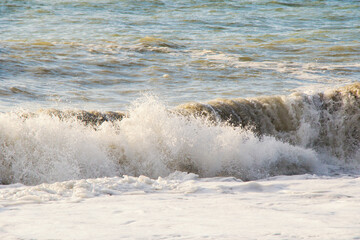 Stormy Black sea. Water background, stormy weather, waves and splashes in Batumi, Georgia.