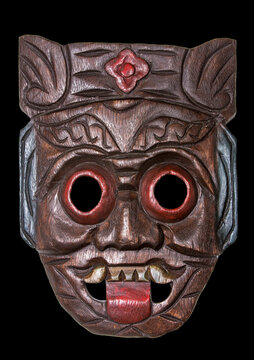 wooden mask African mask mask of the peoples of Asia, cut out the picture on a black background